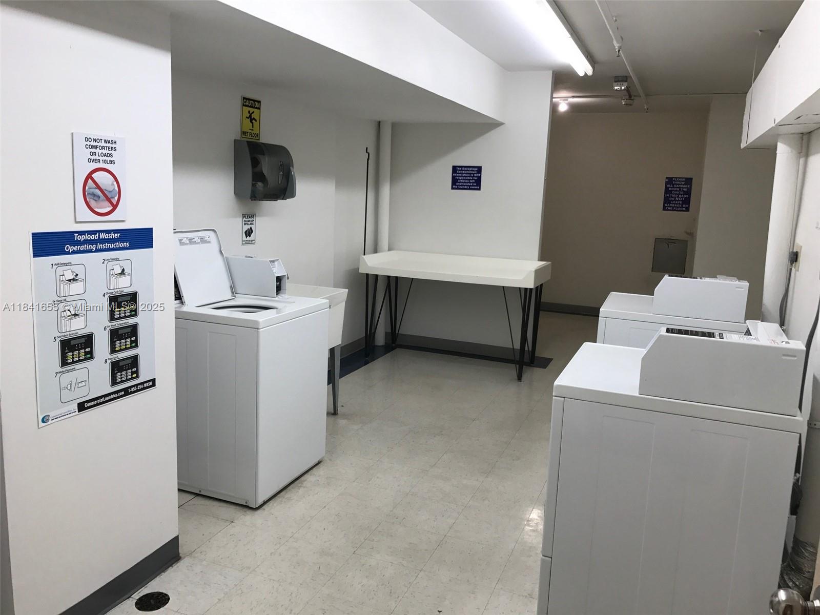 100 Lincoln Road, Unit 1419 Miami Beach, FL 33139 - Photo 45 of 57 a utility room with dryer and washer