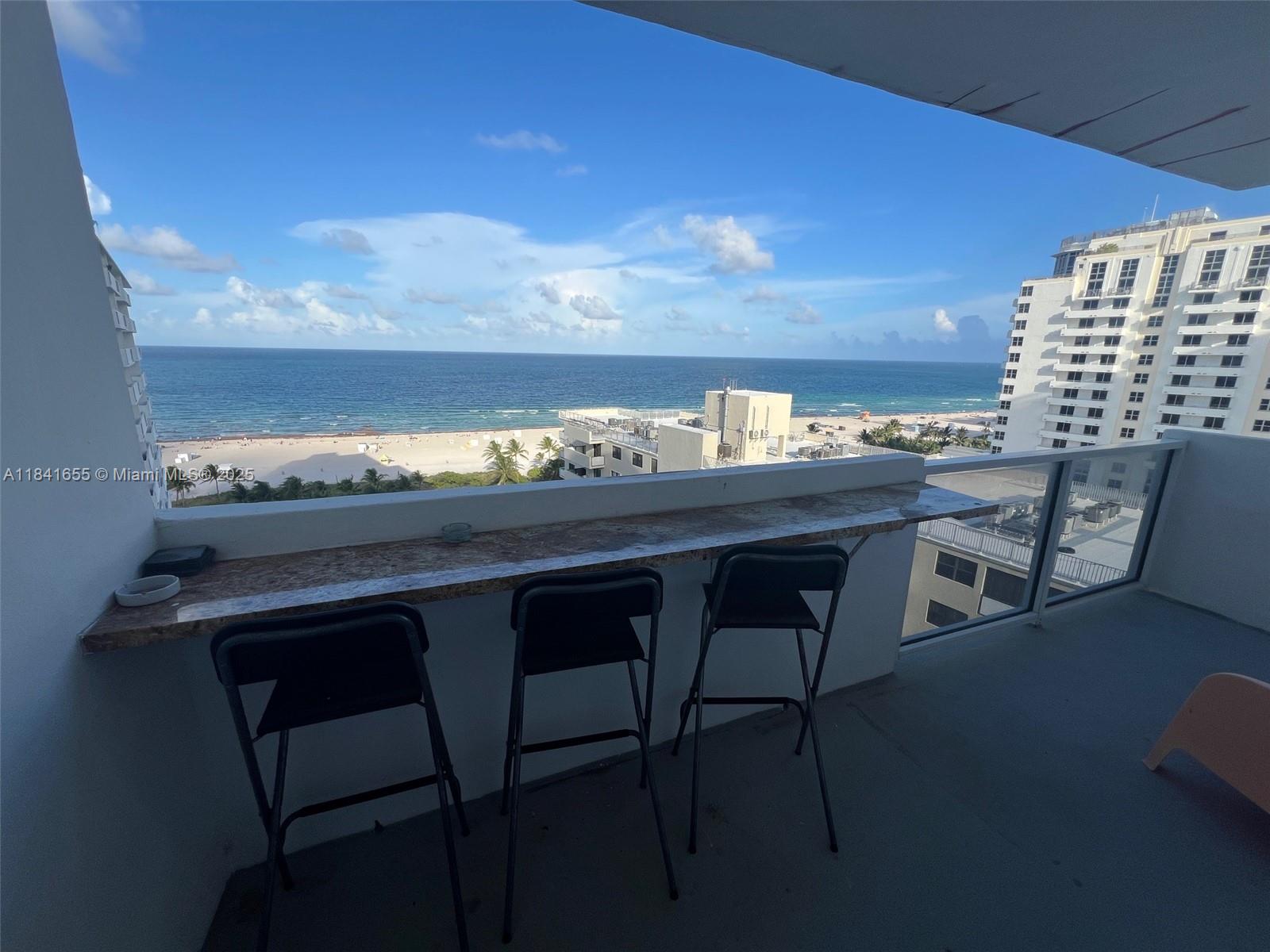 100 Lincoln Road, Unit 1419 Miami Beach, FL 33139 - Photo 5 of 57 a view of a dining room with furniture and a lamp
