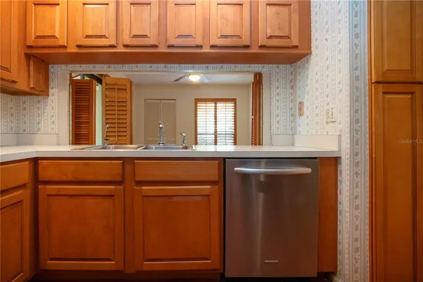 a bathroom with a sink and a window