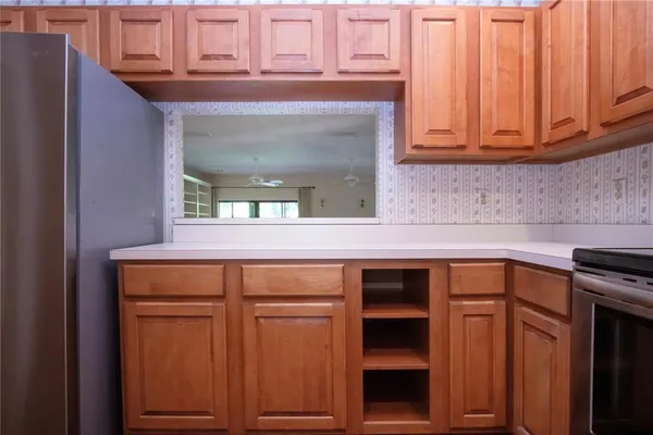 a stove top oven sitting inside of a kitchen