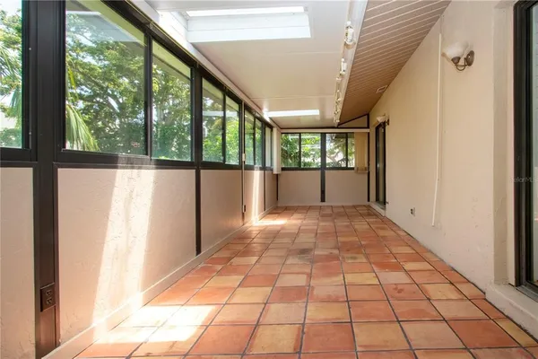 a view of empty room with window and outdoor view