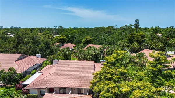an aerial view of house with yard