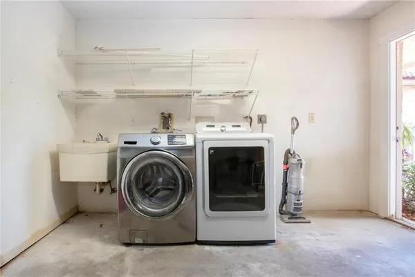a utility room with dryer and washer