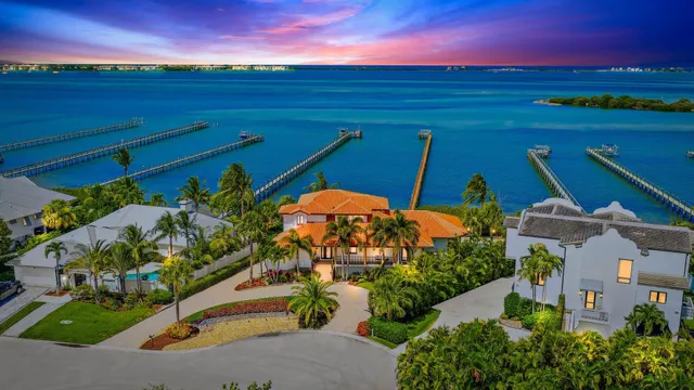 an aerial view of a house with swimming pool garden and patio