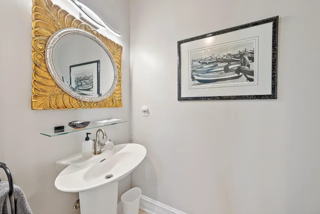 a bedroom with a bed and a large mirror