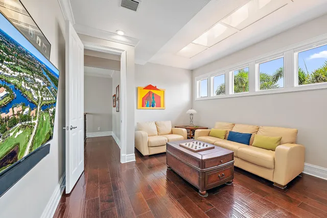 a view of a house with a yard and potted plants