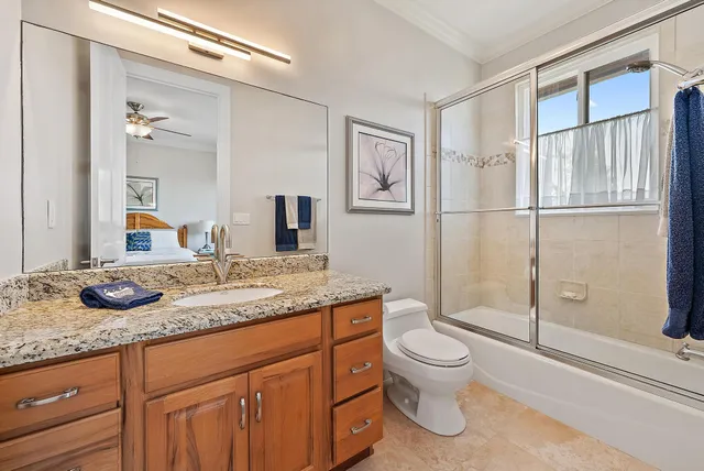 a view of water heater room with a door and wooden floor