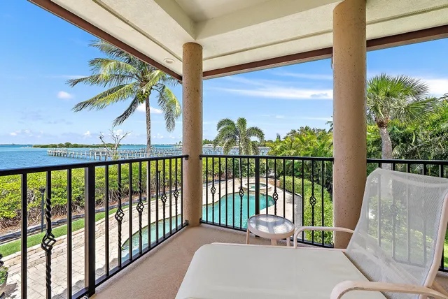 a view of a patio with table and chairs potted plants