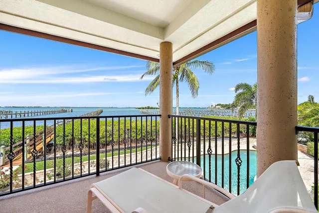 an aerial view of a house with swimming pool garden and patio