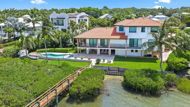 a room with furniture and large windows