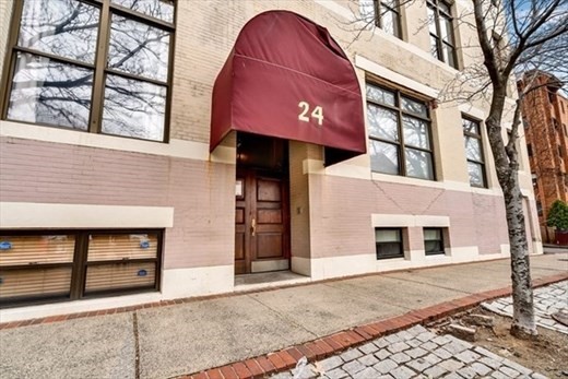 a front view of a house with a garage