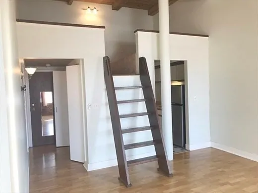 a view of front door with wooden floor