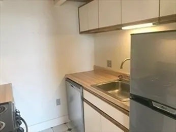 a kitchen with a stove and a microwave