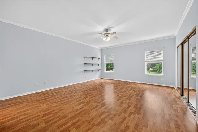 a bathroom with a sink double vanity granite tub and a mirror