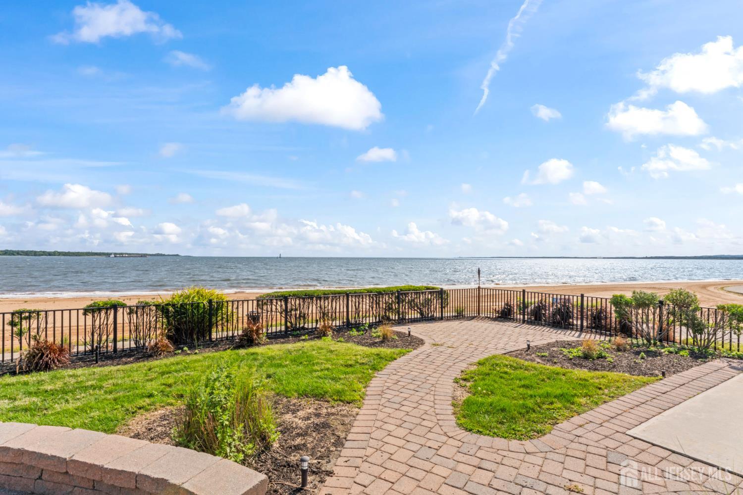 76 Raritan Reach Road South Amboy, NJ 08879 - Photo 25 of 69 a view of a swimming pool with an outdoor seating and a yard