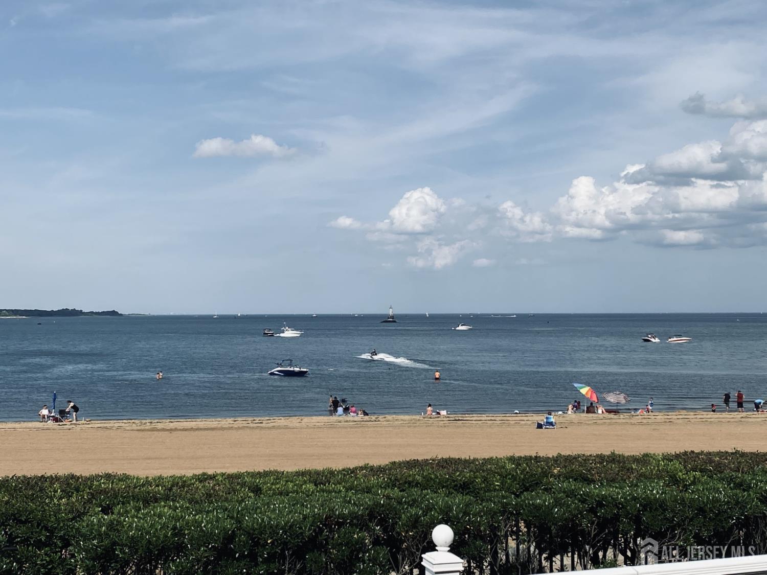 76 Raritan Reach Road South Amboy, NJ 08879 - Photo 26 of 69 a view of an ocean beach and mountain