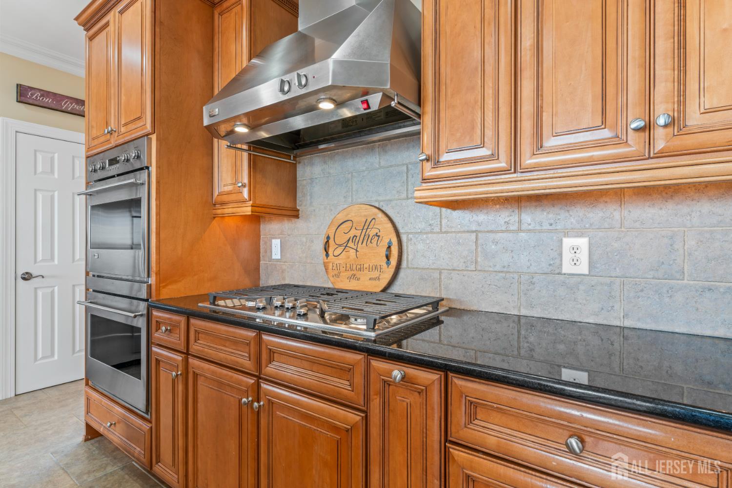 76 Raritan Reach Road South Amboy, NJ 08879 - Photo 37 of 69 a kitchen with granite countertop a sink and a stove
