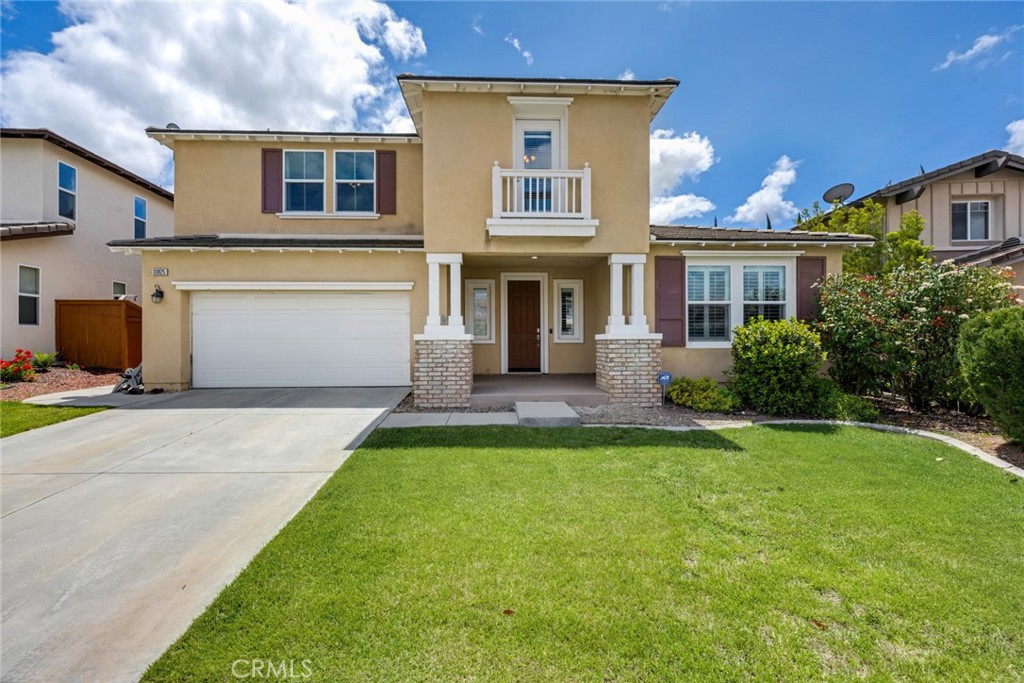 33825 Sattui Street Temecula, CA 92592 - Photo 1 of 1 a front view of a house with garden