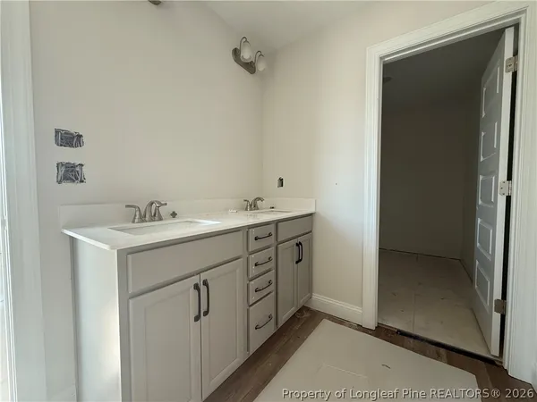 a utility room with cabinets washer and dryer