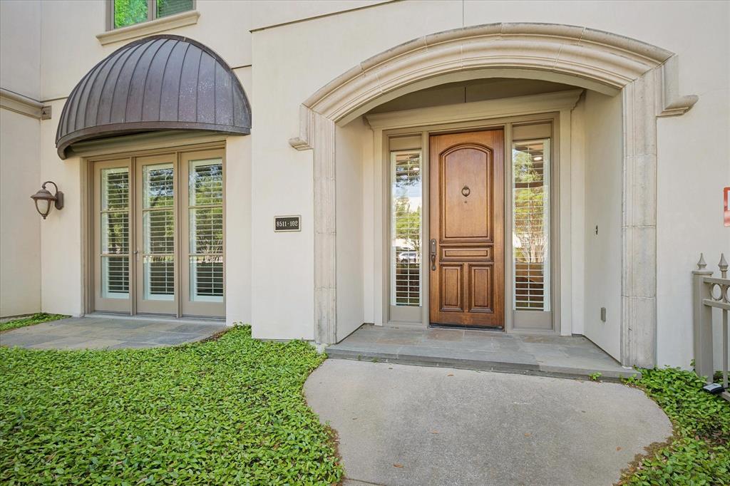 a view of front door with a house