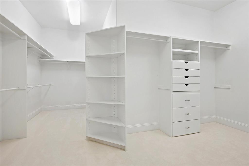 8511 Edgemere Road, Unit 102 Dallas, TX 75225 - Photo 12 of 17 a view of an empty walk in closet