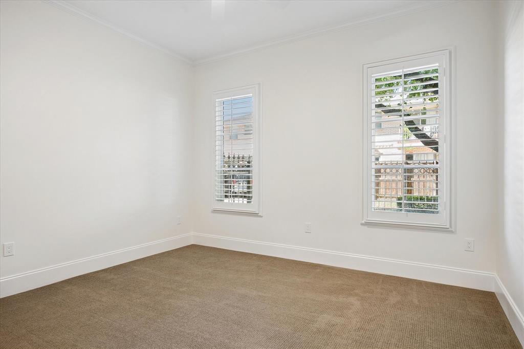 8511 Edgemere Road, Unit 102 Dallas, TX 75225 - Photo 13 of 17 an empty room with a window