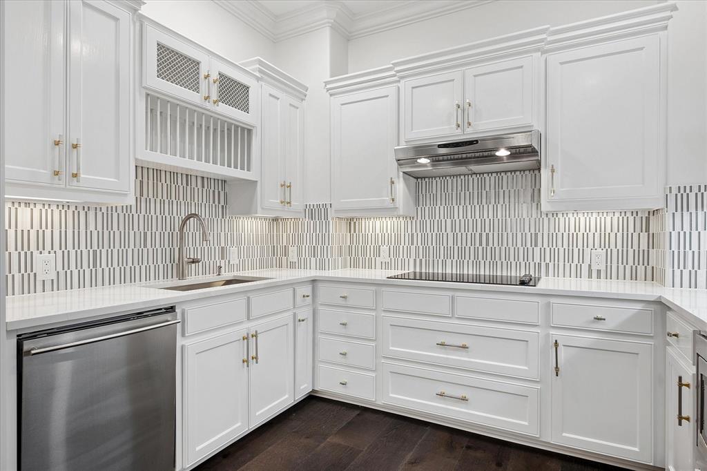 8511 Edgemere Road, Unit 102 Dallas, TX 75225 - Photo 8 of 17 a kitchen with granite countertop white cabinets and white appliances
