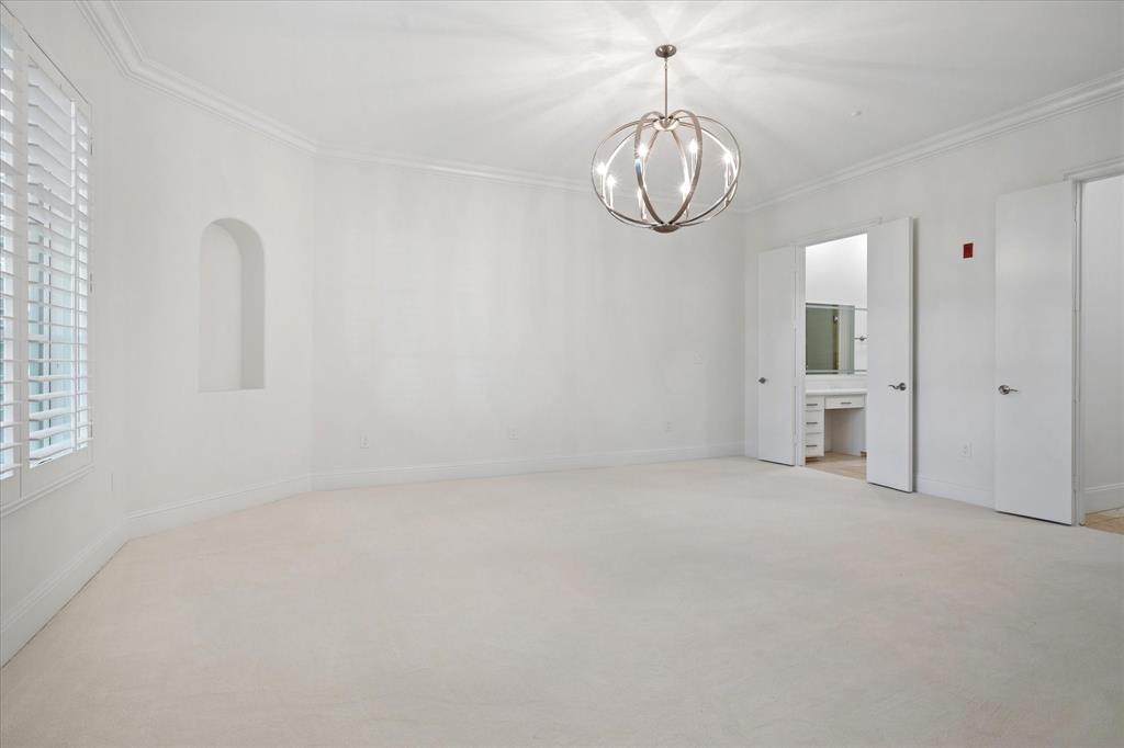 8511 Edgemere Road, Unit 102 Dallas, TX 75225 - Photo 9 of 17 a view of empty room with windows
