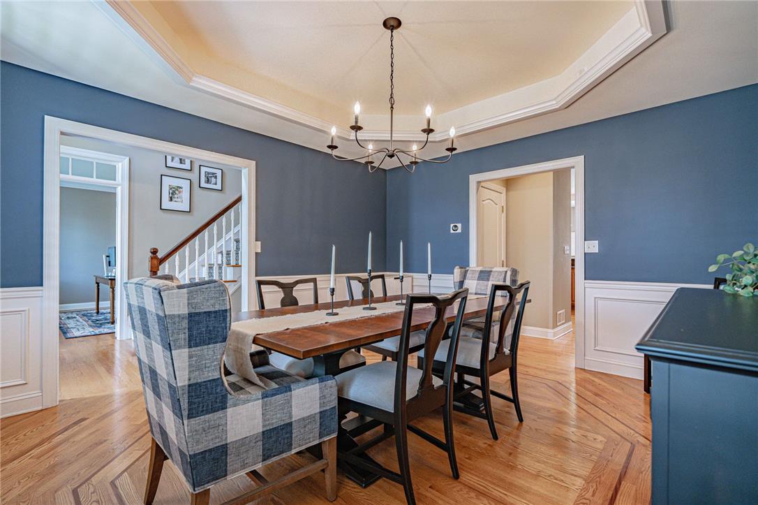 6000 Pond View Terrace Bath, PA 18014 - Photo 17 of 69 Hardwood floors and crisp wainscoting define this formal dining space, ideal for entertaining.