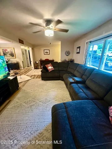 a living room with a couch and a flat screen tv