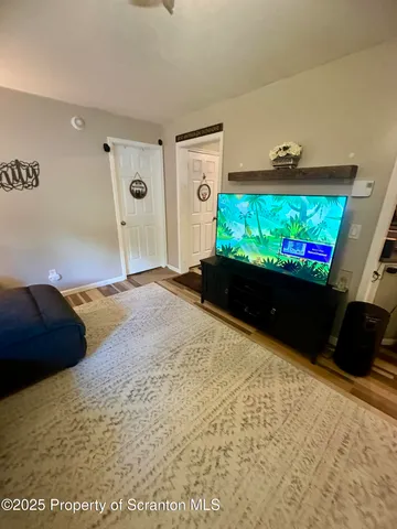 a bathroom with a sink mirror vanity and toilet