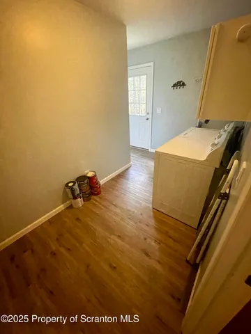 a view of a livingroom with furniture and a flat screen tv