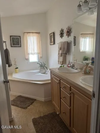 a bedroom with a bed and a mirror