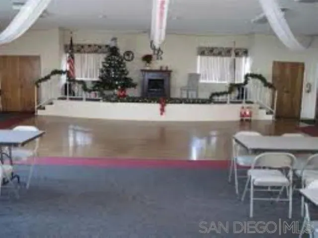 a view of kitchen and dining area with chandelier
