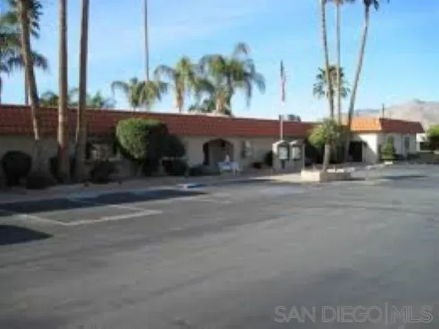 a view of a street with a cars on the road