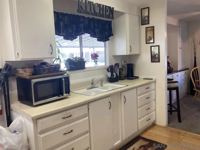 a kitchen with stainless steel appliances a stove and a sink