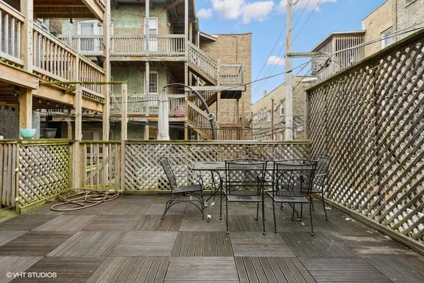 a view of a chair and table in the balcony