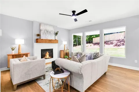 a living room with furniture and a fireplace