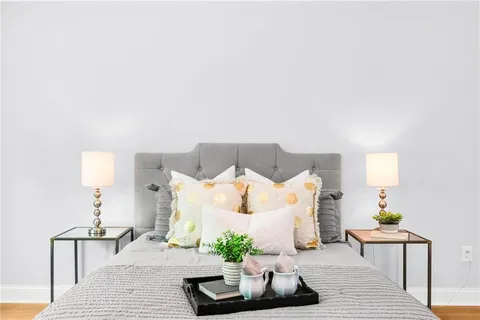 a bed room with a bed and a lamp