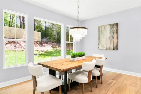 a view of a dining room with furniture window and outside view