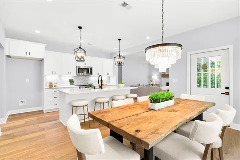 a very nice looking dining room with a table and chairs