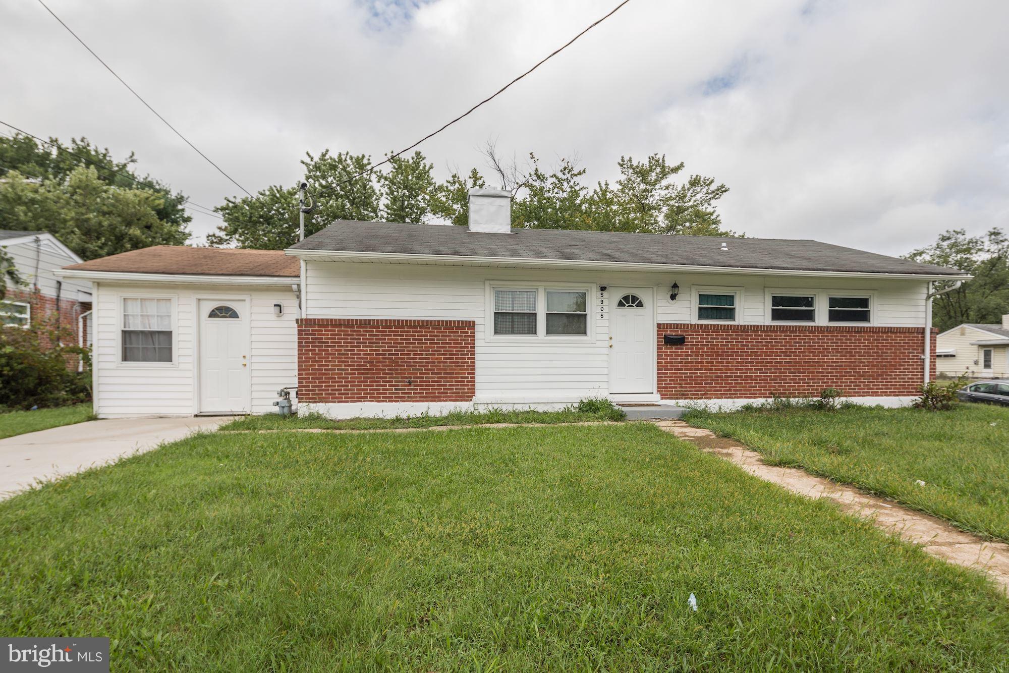 5905 Johnnycake Road Baltimore, MD 21228 - Photo 1 of 30 a front view of house with yard and green space