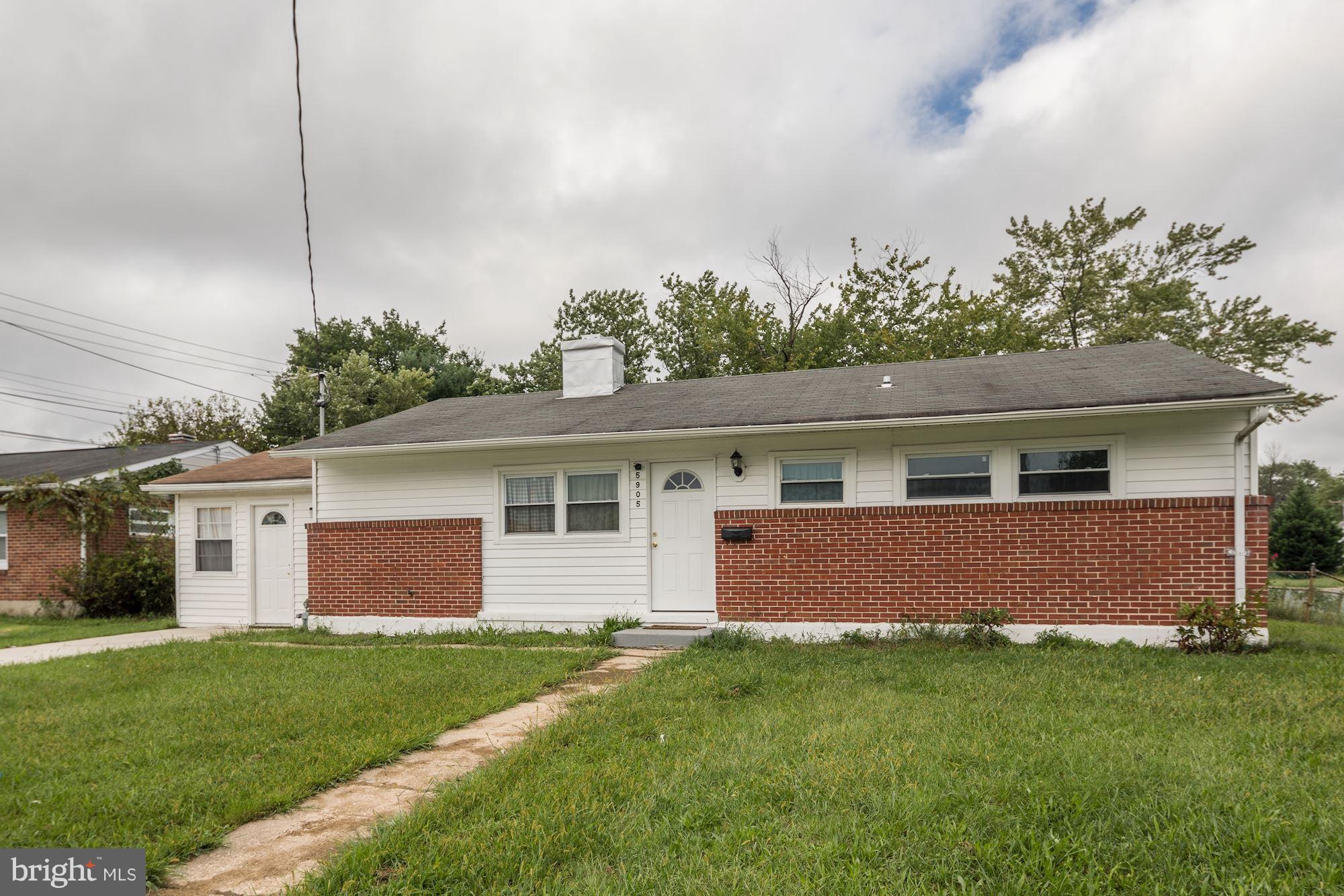 5905 Johnnycake Road Baltimore, MD 21228 - Photo 2 of 30 a front view of house with yard and green space