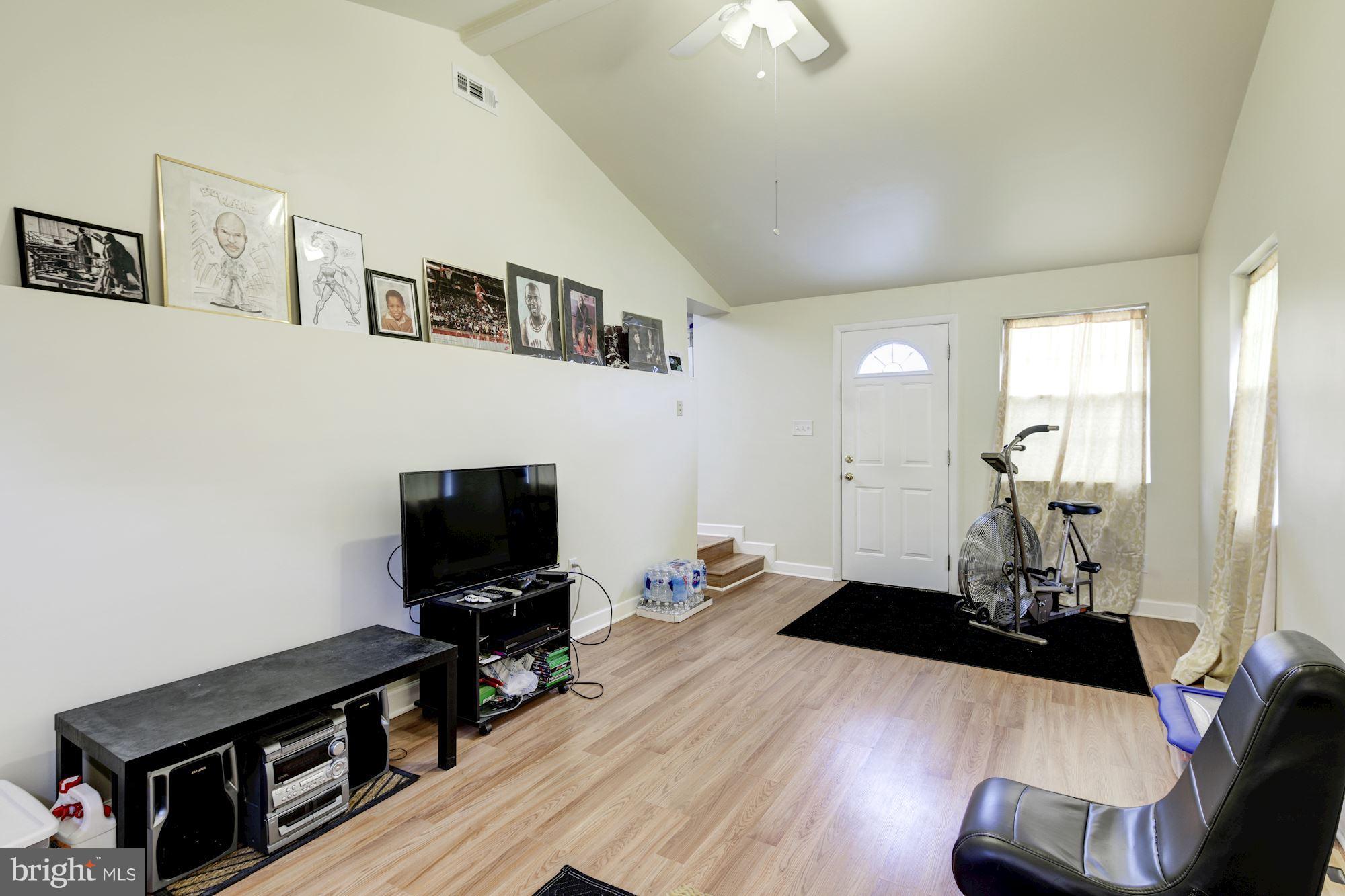 5905 Johnnycake Road Baltimore, MD 21228 - Photo 17 of 30 a living room with furniture and a flat screen tv