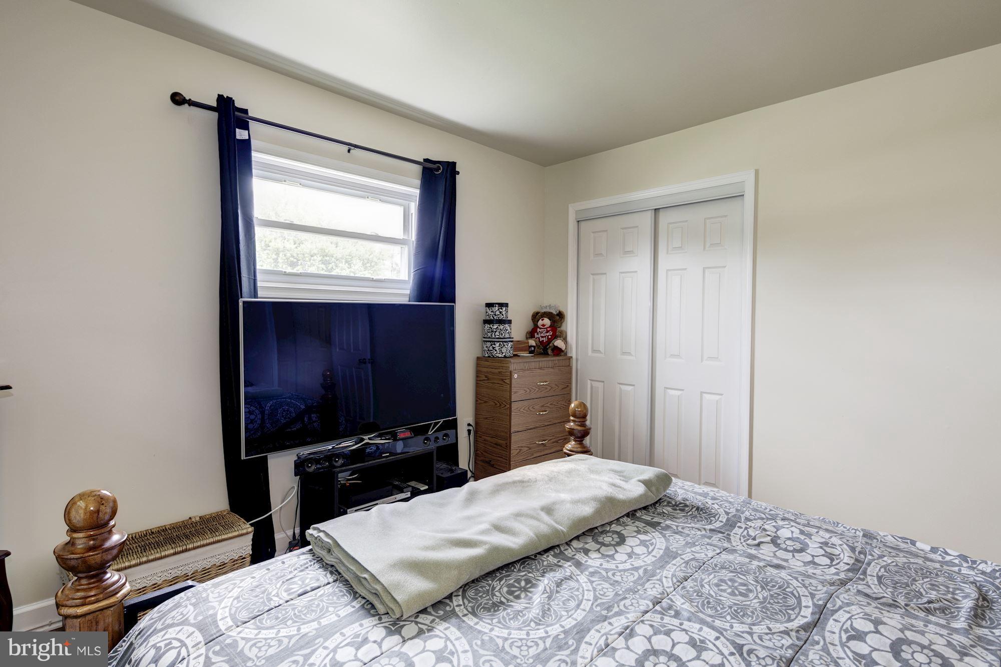 5905 Johnnycake Road Baltimore, MD 21228 - Photo 23 of 30 a bedroom with a bed and a tv