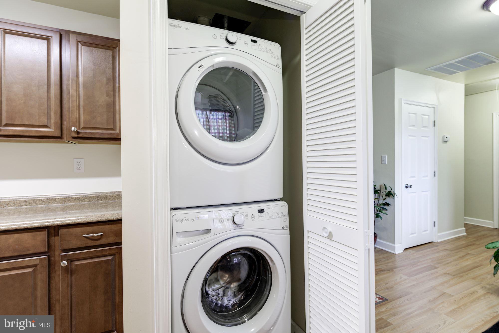 5905 Johnnycake Road Baltimore, MD 21228 - Photo 28 of 30 a view of a hallway with washer and dryer