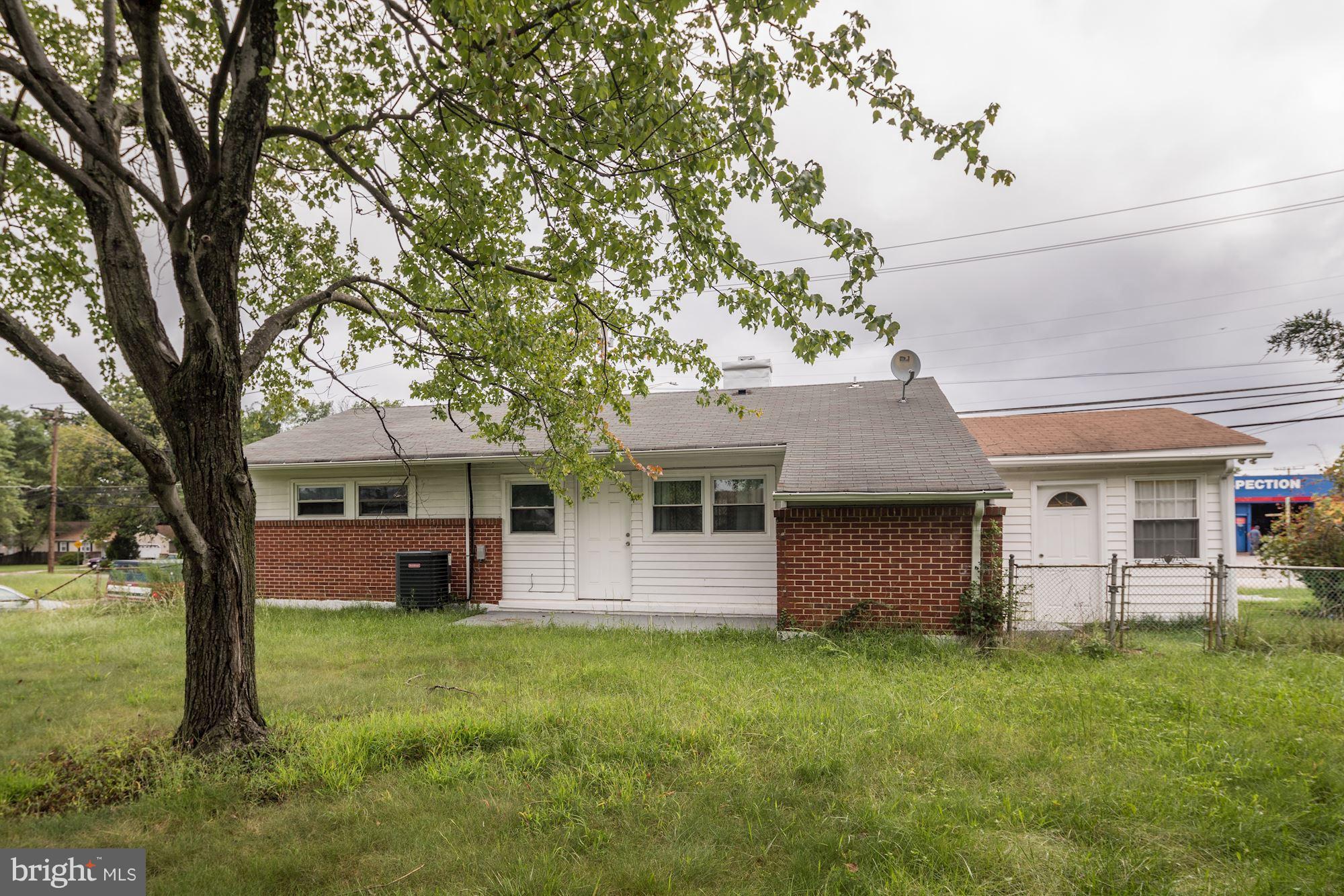 5905 Johnnycake Road Baltimore, MD 21228 - Photo 29 of 30 a front view of house with yard and green space