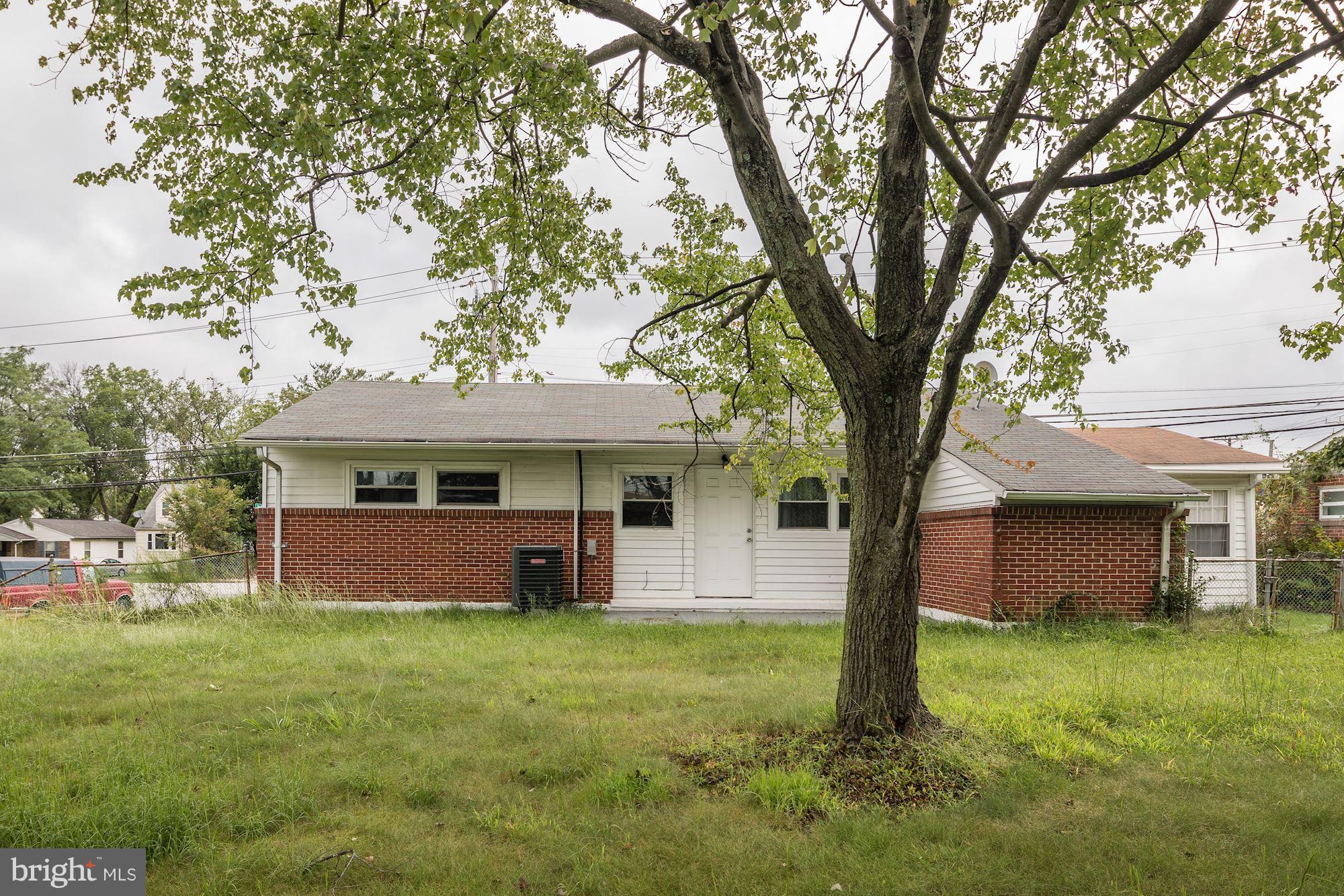 5905 Johnnycake Road Baltimore, MD 21228 - Photo 30 of 30 a front view of a house with a garden