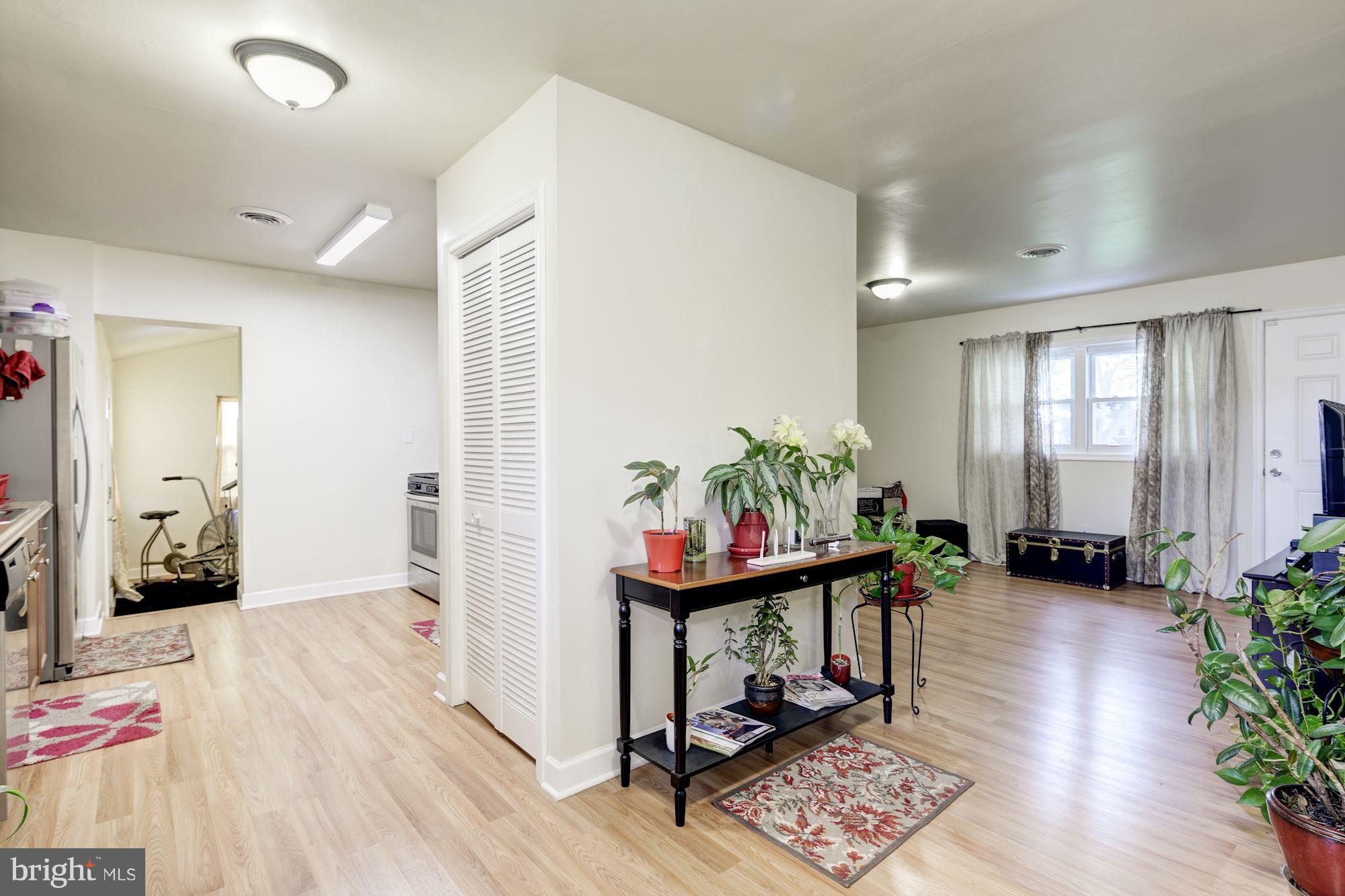 5905 Johnnycake Road Baltimore, MD 21228 - Photo 4 of 30 a hallway with furniture and wooden floor