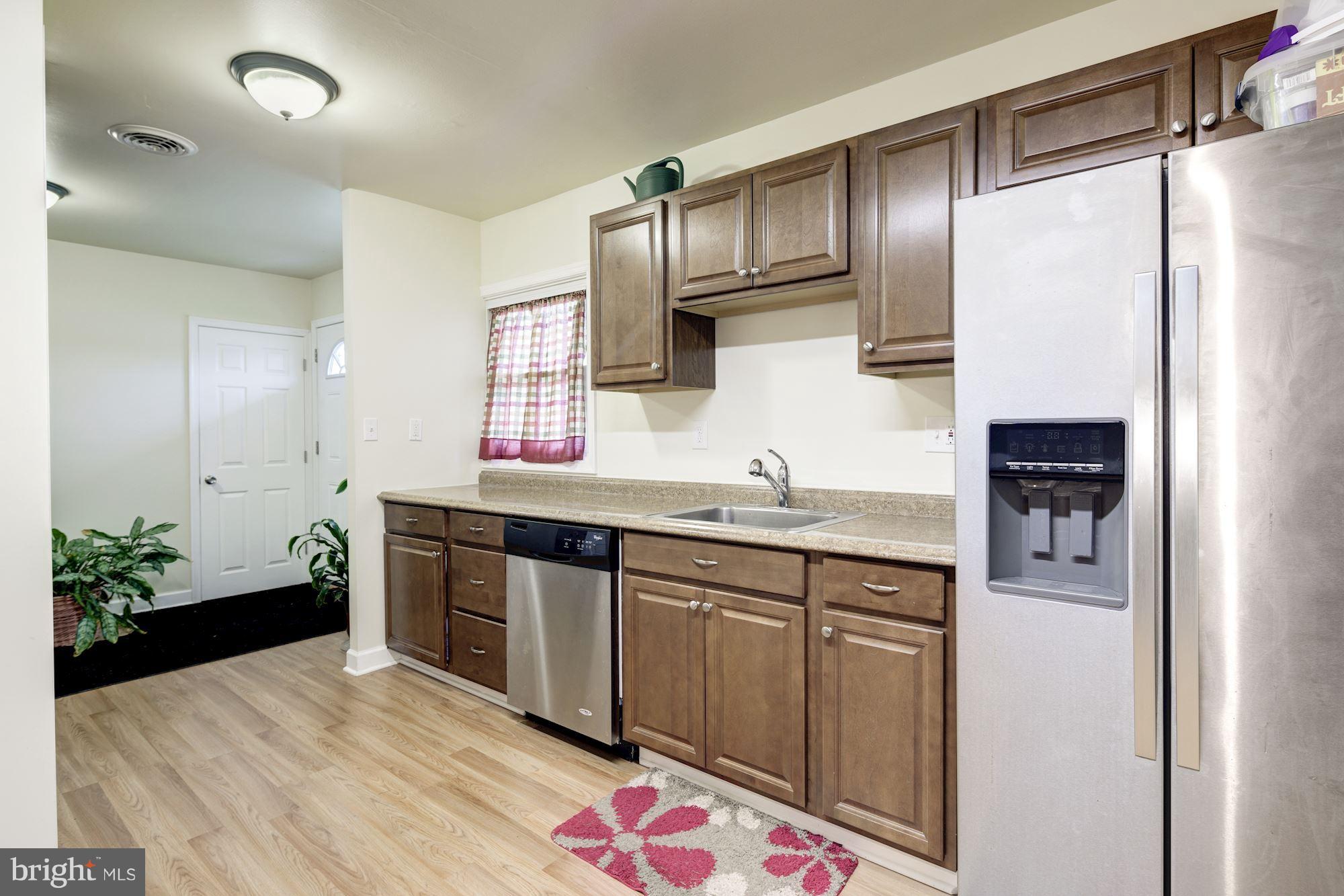 5905 Johnnycake Road Baltimore, MD 21228 - Photo 5 of 30 a spacious bathroom with a sink double vanity and a mirror